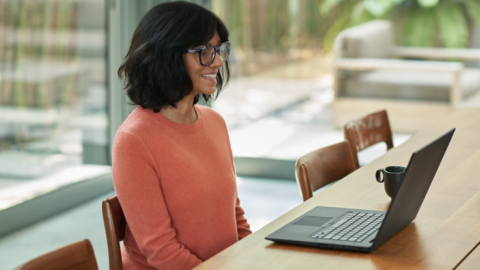 woman smiling on teams call while working from home