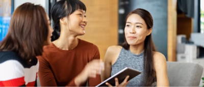 A group of people talking with each other.