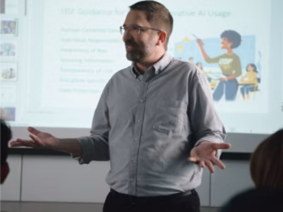 A person in a grey shirt.