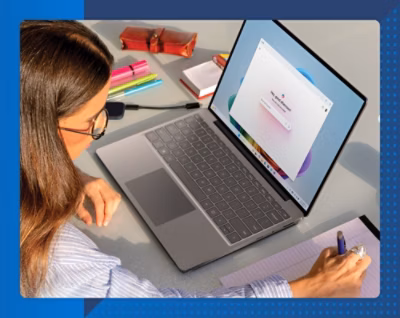 A woman using a laptop.