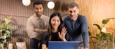 A group of people looking at a computer screen.