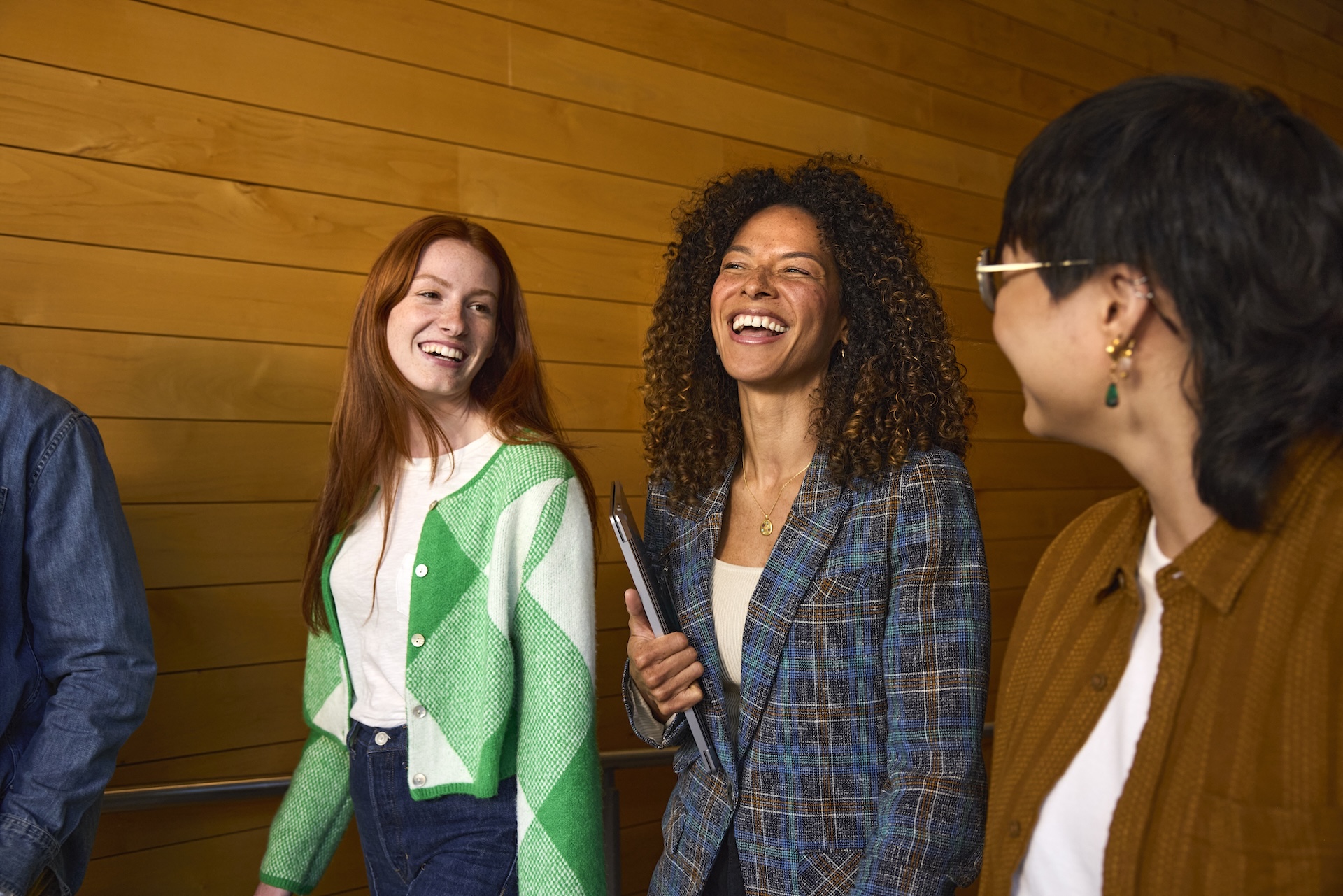 Group of people talking and laughing.